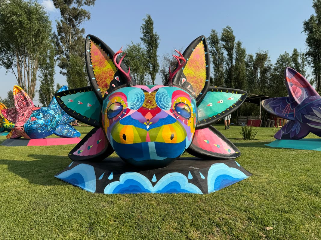A sculpture painted with a bold graphic face