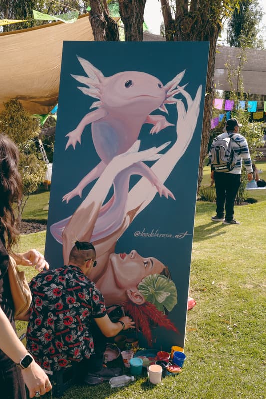 A large painted axolotl panel on display