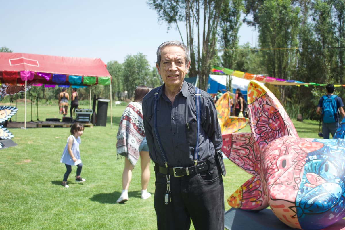A guest on the lawn beside one of the sculptures