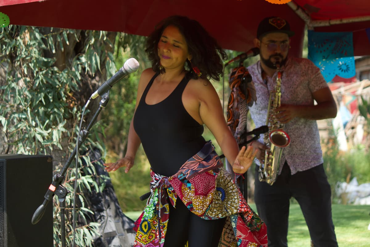 A singer and saxophonist performing for the guests