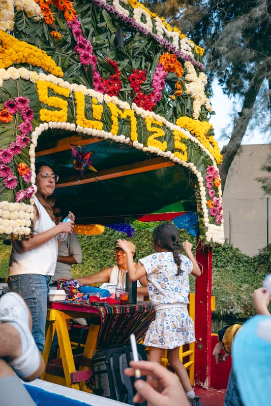 The flower-arched Somos trajinera with guests aboard