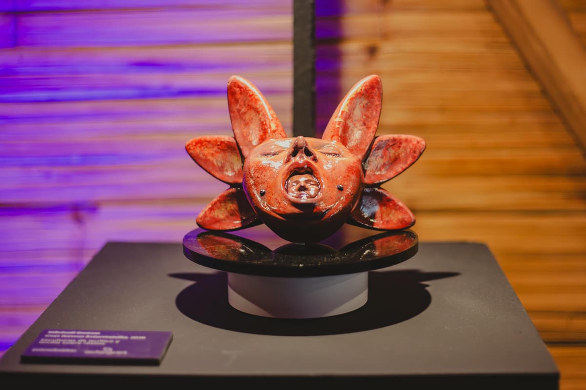 An orange sculpture on display
