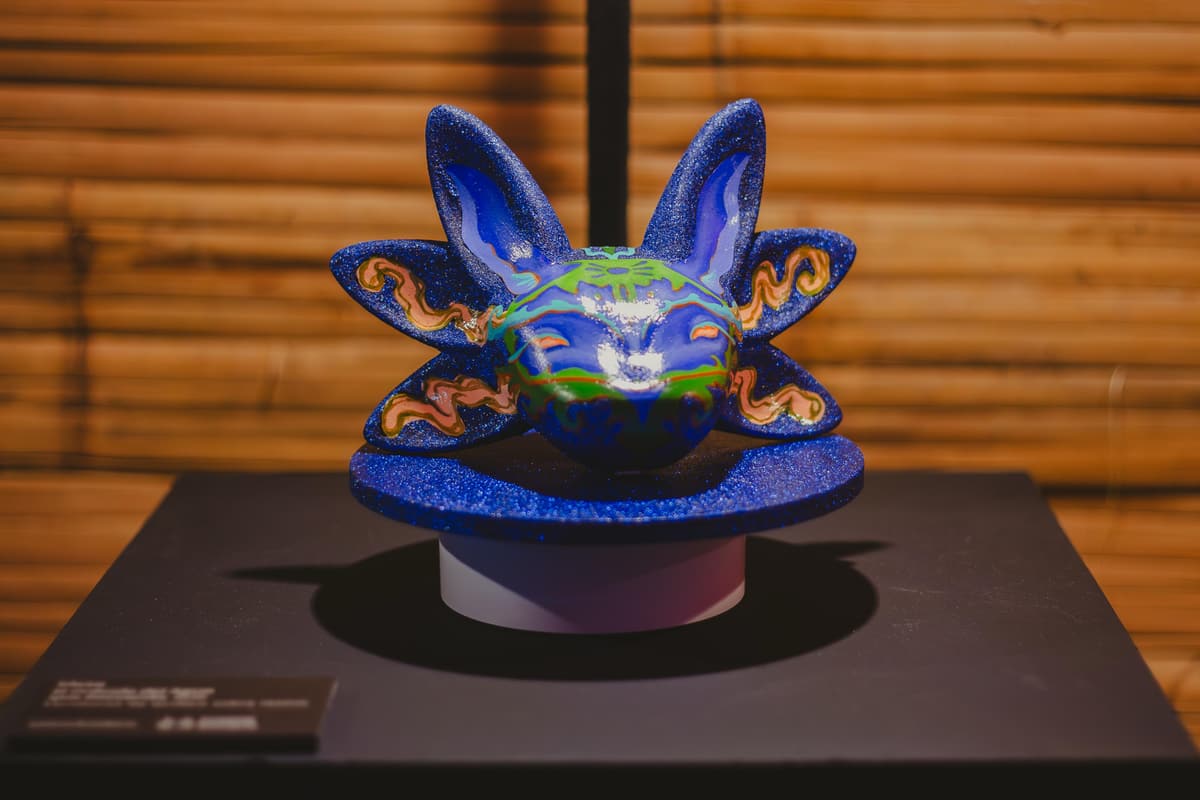 A sculpture painted with a blue globe motif