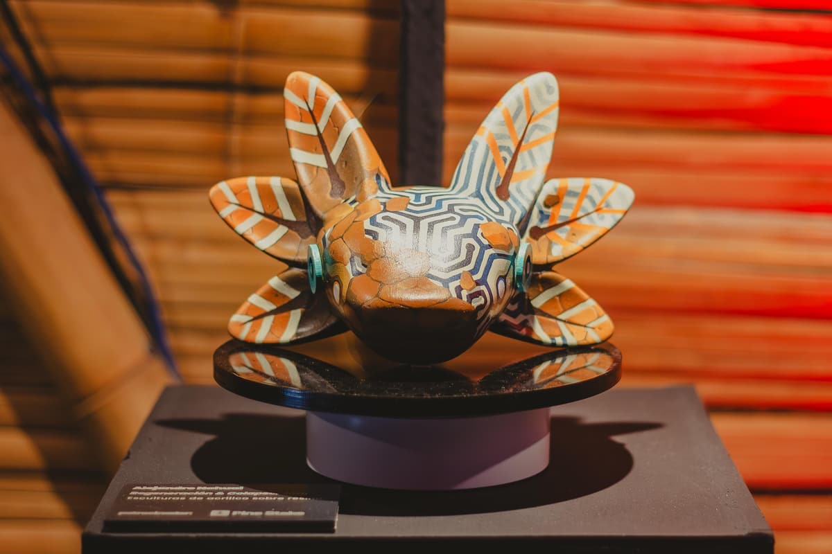 A finely patterned sculpture on its plinth