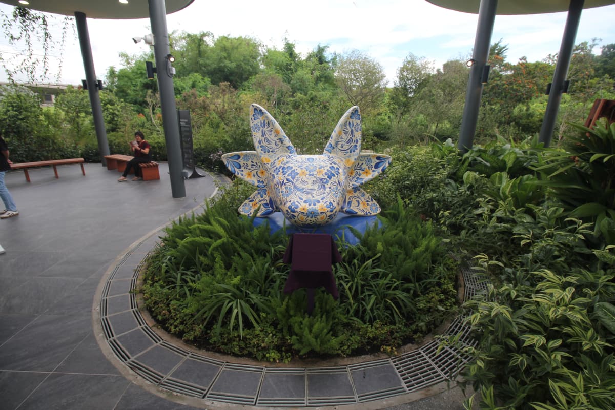 The sculpture on its circular planted island