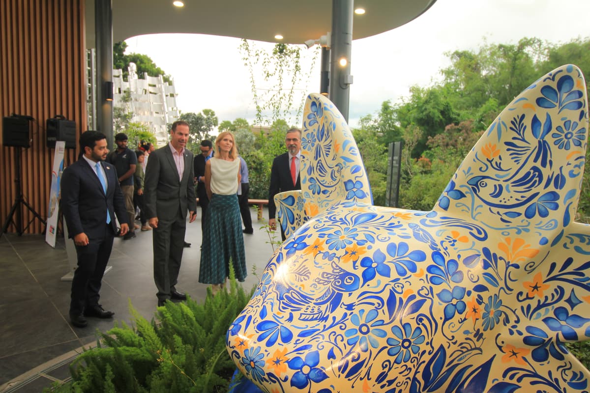 Guests gathered around the sculpture