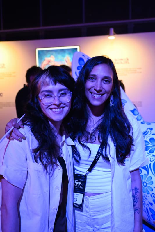Two of the team smiling together at the event