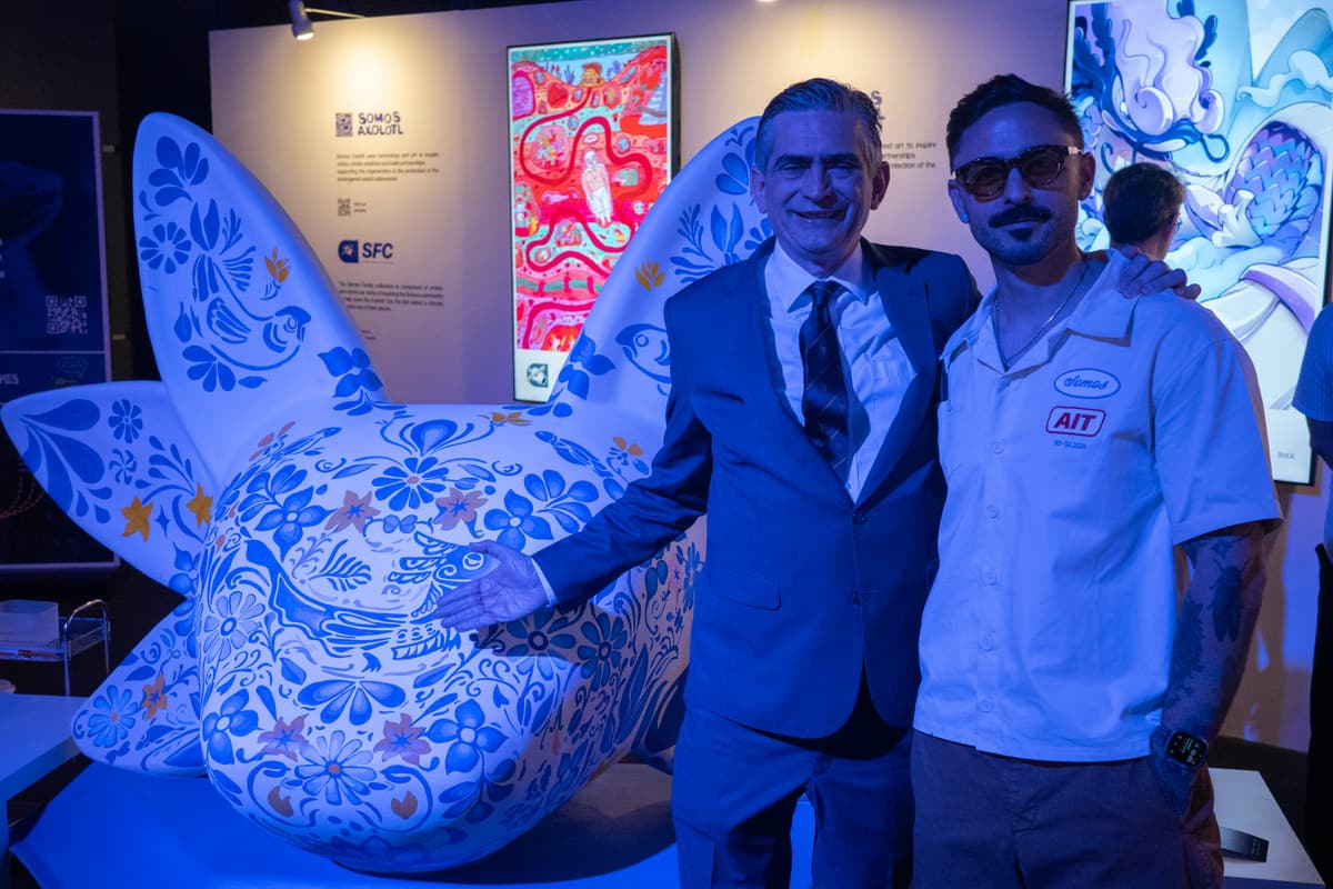 Two attendees beside the finished sculpture